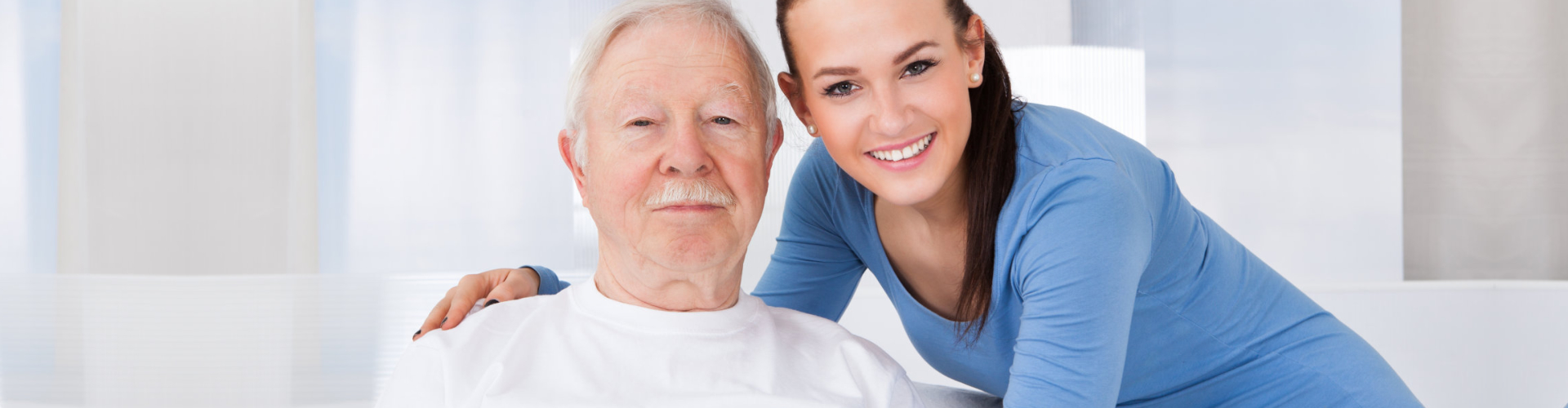 sitting elderly man with a middle aged woman